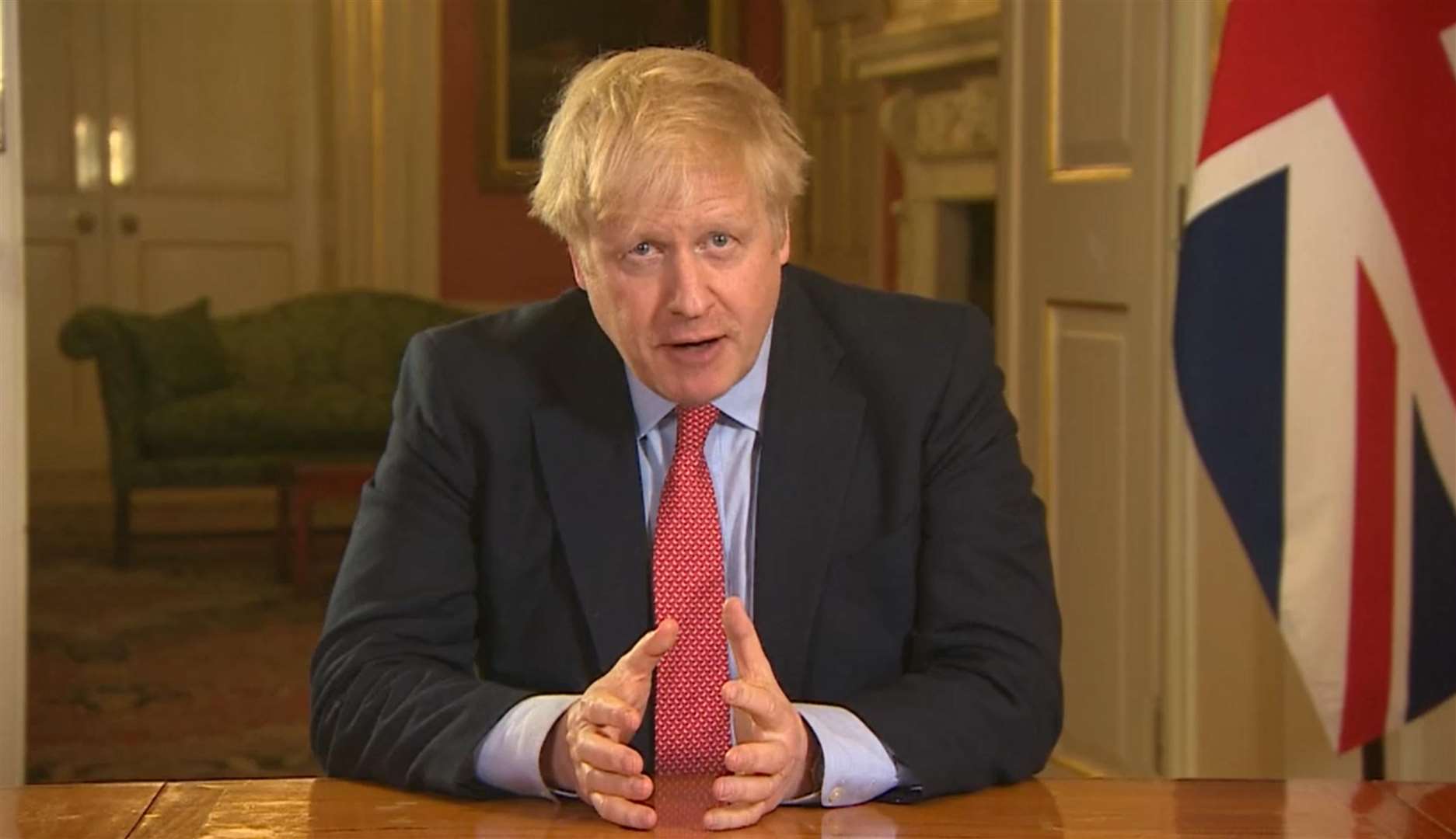 Prime Minister Boris Johnson addresses the nation from 10 Downing Street (PA)