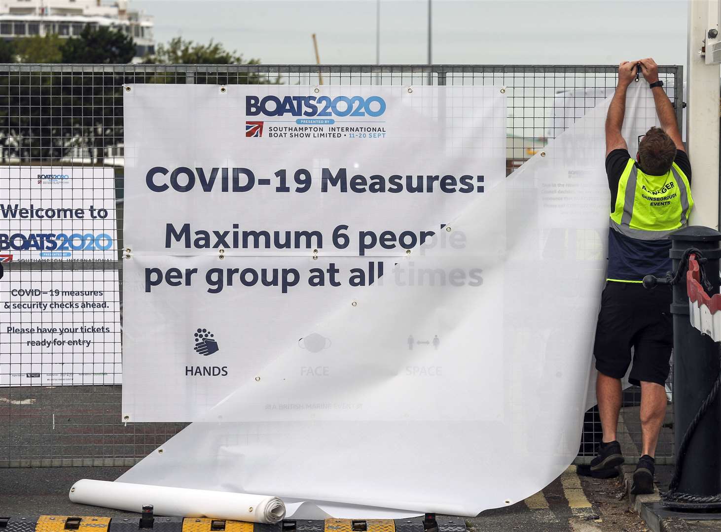 Staff put up screens at the Boats2020 show in Southampton following the cancellation of the event (Steve Parsons/PA)