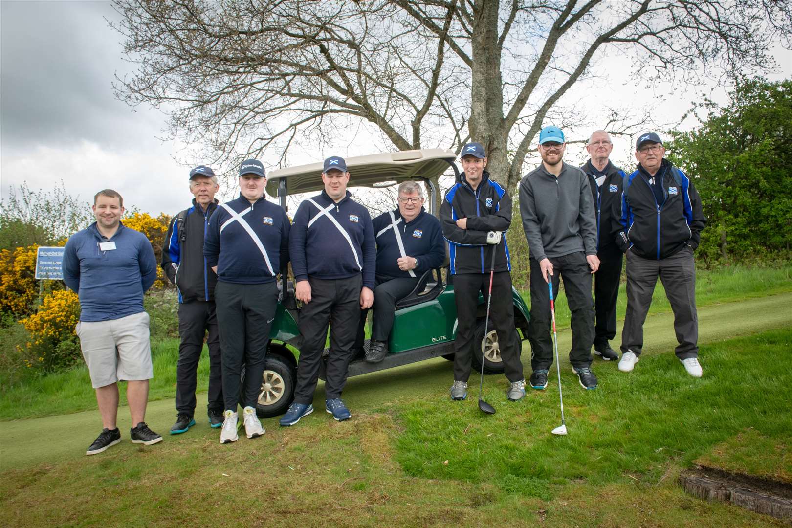 Organiser Ronnie Mitchell (seated) with some of the golfers and caddies taking part. Picture: Callum Mackay