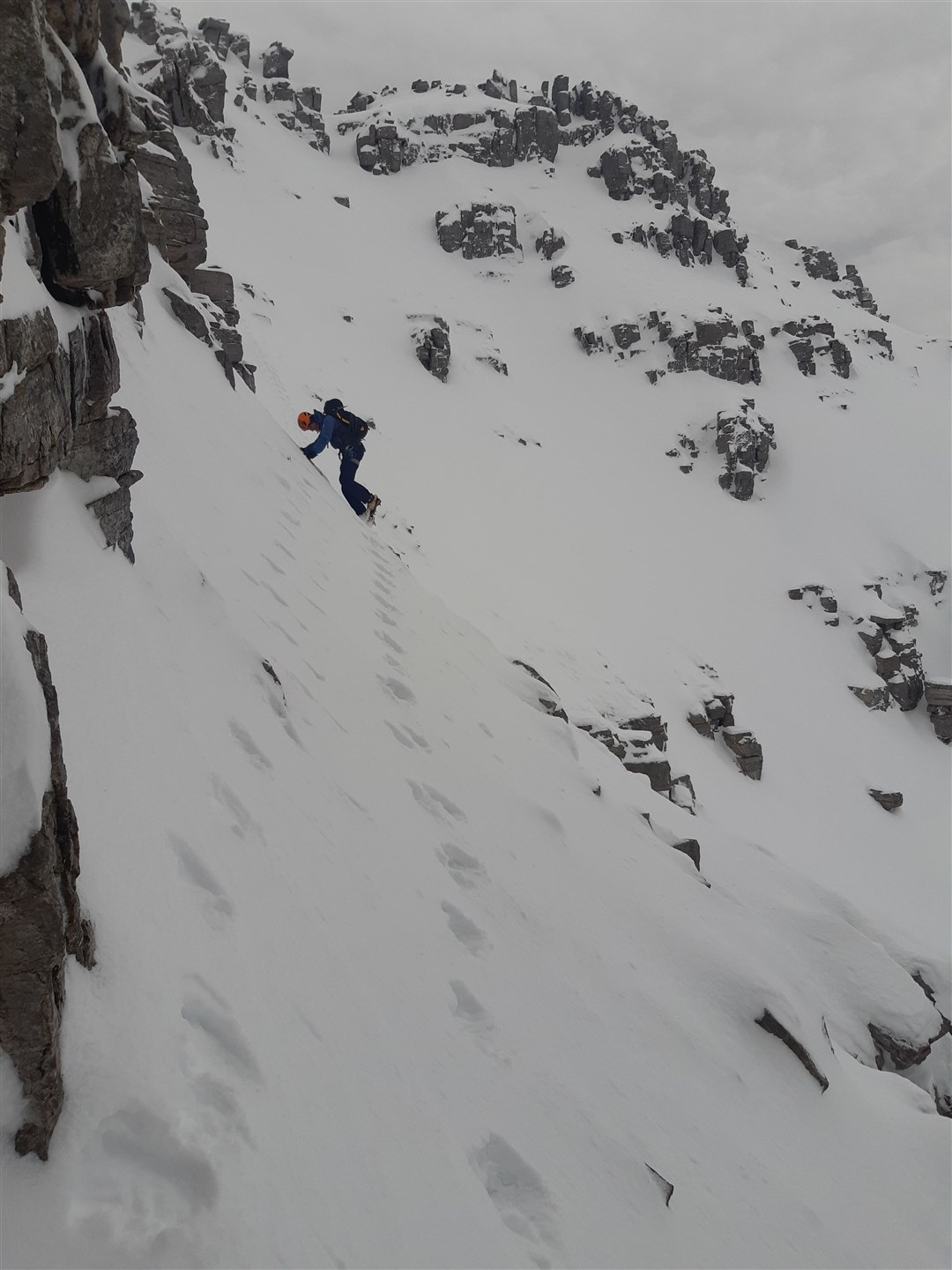 Traversing a steep slope in deep snow. Picture: Ben Gibson/Mountaineering Scotland
