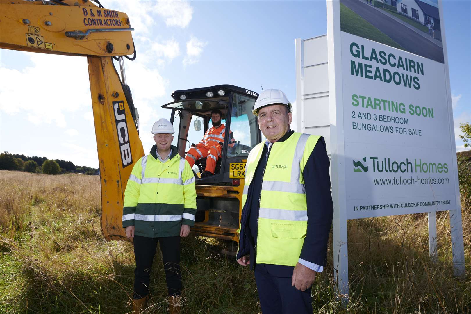 Billy McKay, Tulloch Homes construction director, is the person in front. Behind is Kieran Graham, commercial director with digger driver Ryan Murray.