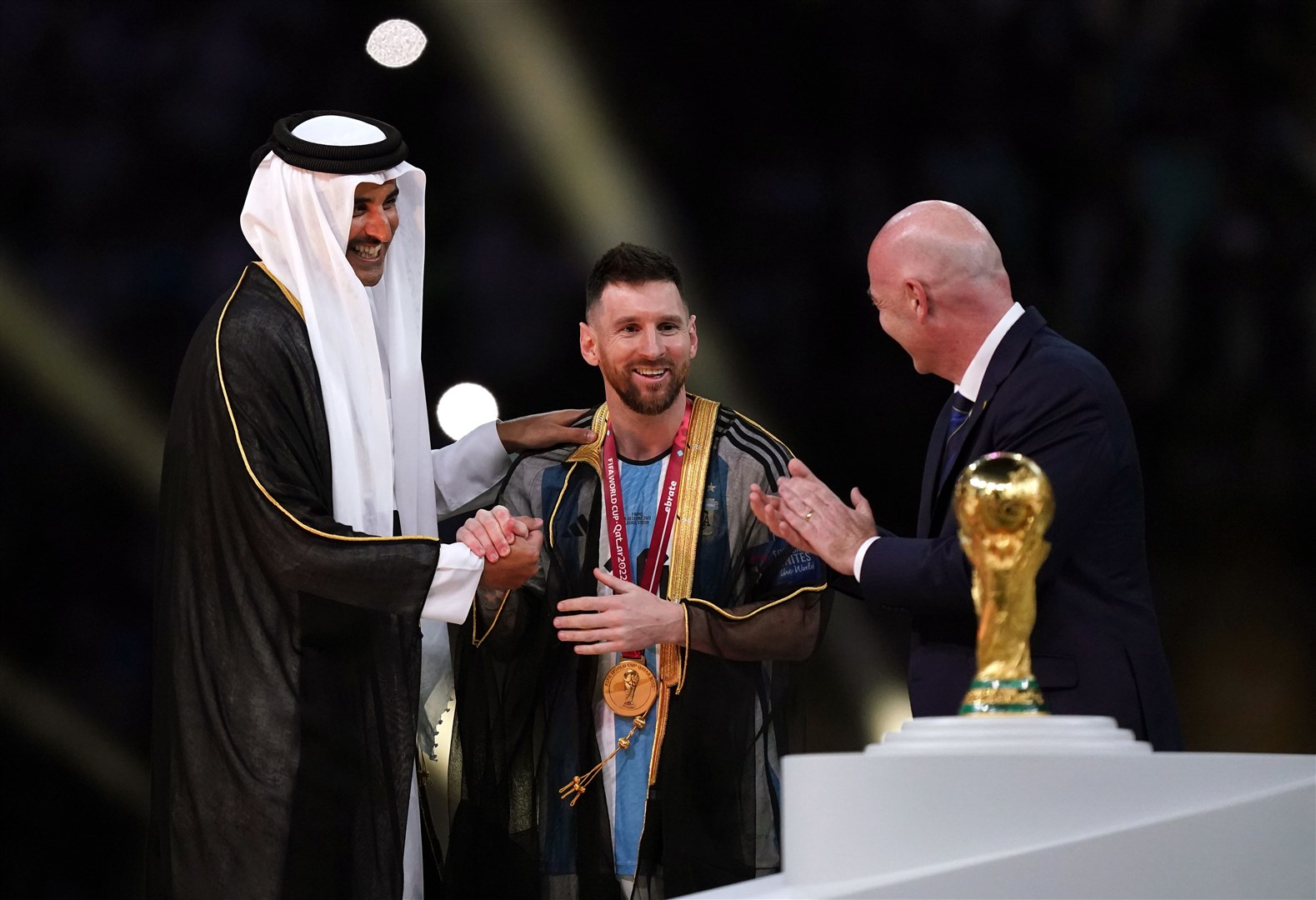 The Emir of Qatar with Lionel Messi and Fifa President Gianni Infantino (Mike Egerton/PA)