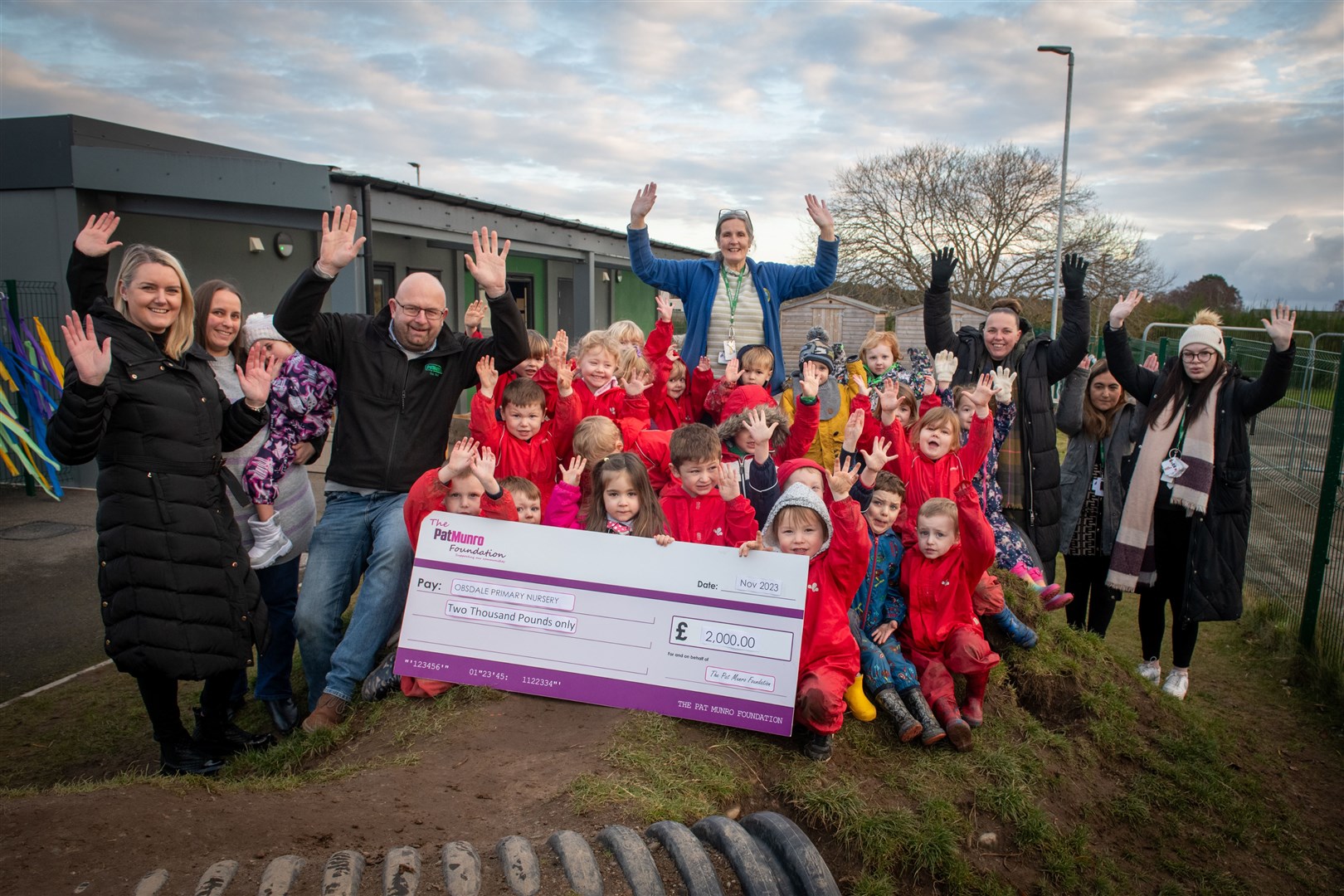 Kerry Wilkie, Tracy Thorpe and Michael MacDonald hand over a cheque for £2000 to staff and children from Obsdale Nursery in Alness. Picture: Callum Mackay.