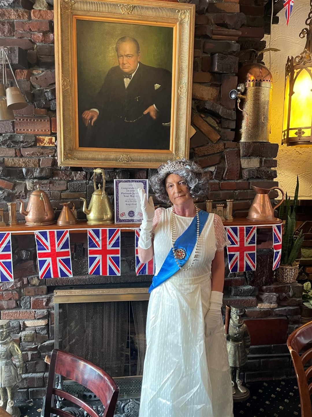 The pub has hired a Queen Elizabeth impersonator to stop by over the weekend (Lisa Powers/PA)