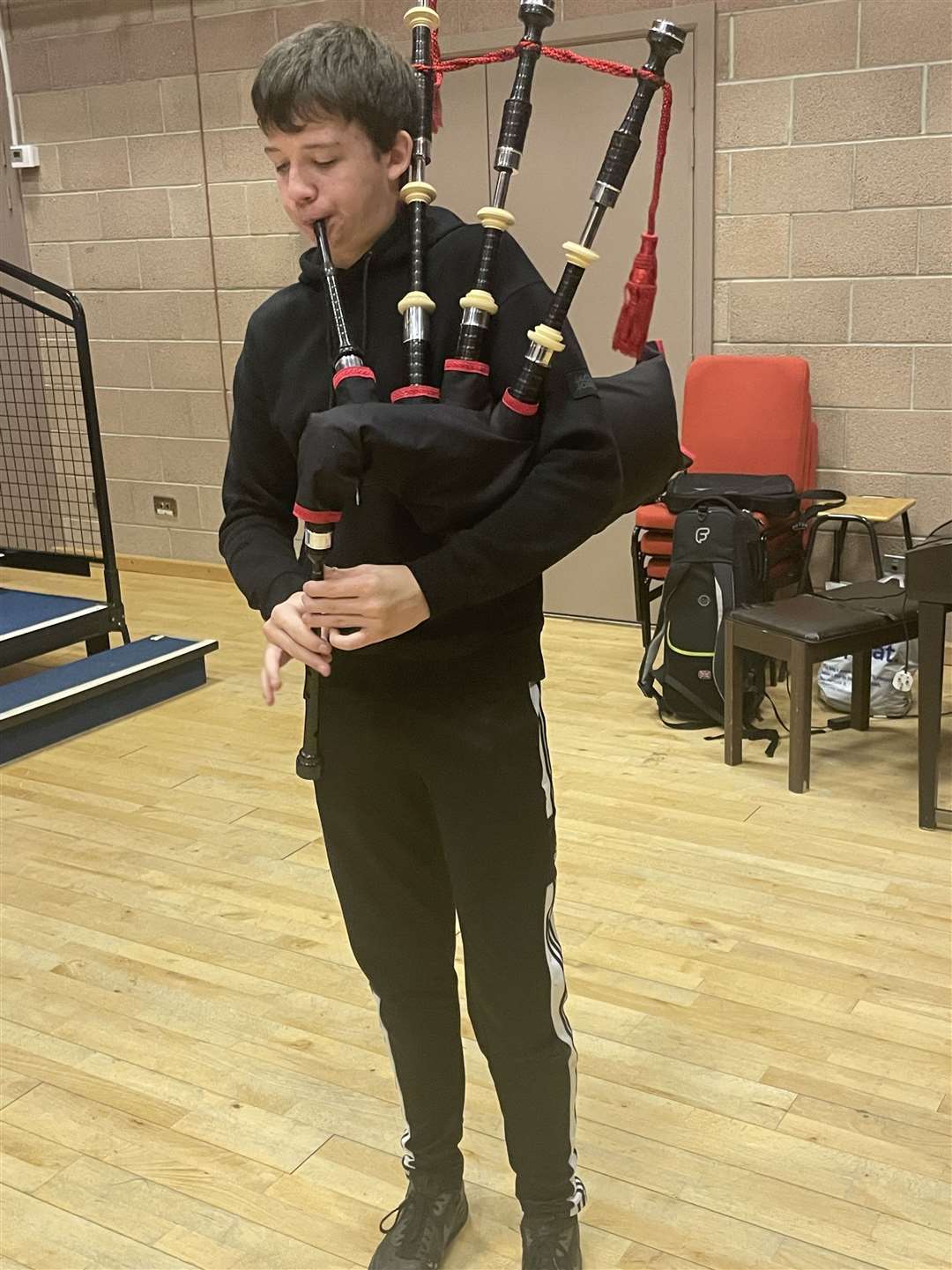 A pupil trys out new set of bagpipes.