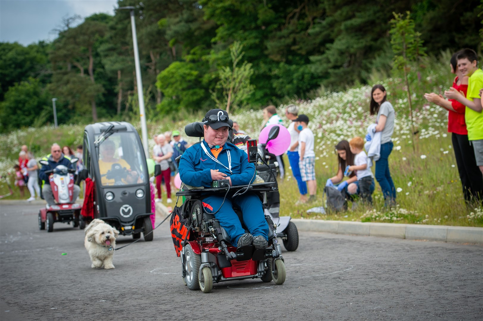 Dylan Bogue's fundraising wheelchair run at Doctor Stewart Campbell Court, Alness. Picture: Callum Mackay