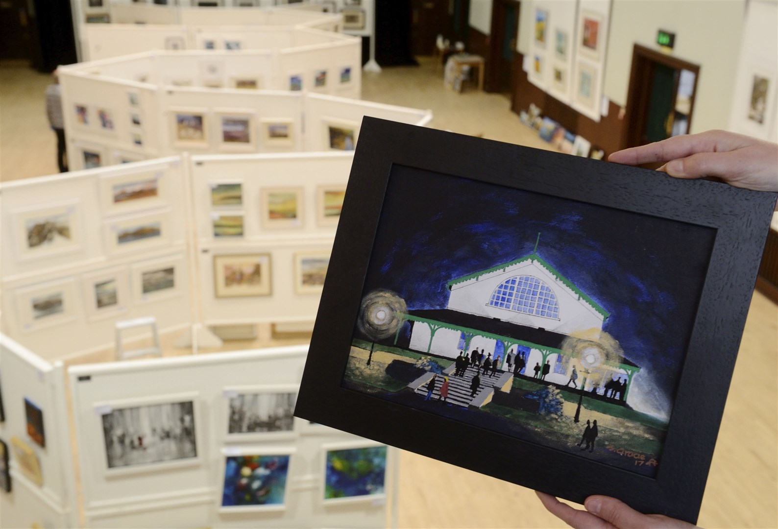 Image from a previous art fair with the familiar Strathpeffer Pavilion featured in a painting by Sandy Gracie. Picture: Gary Anthony