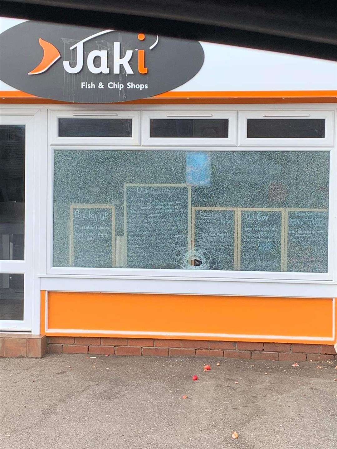 The window of the fish and chip shop was smashed.