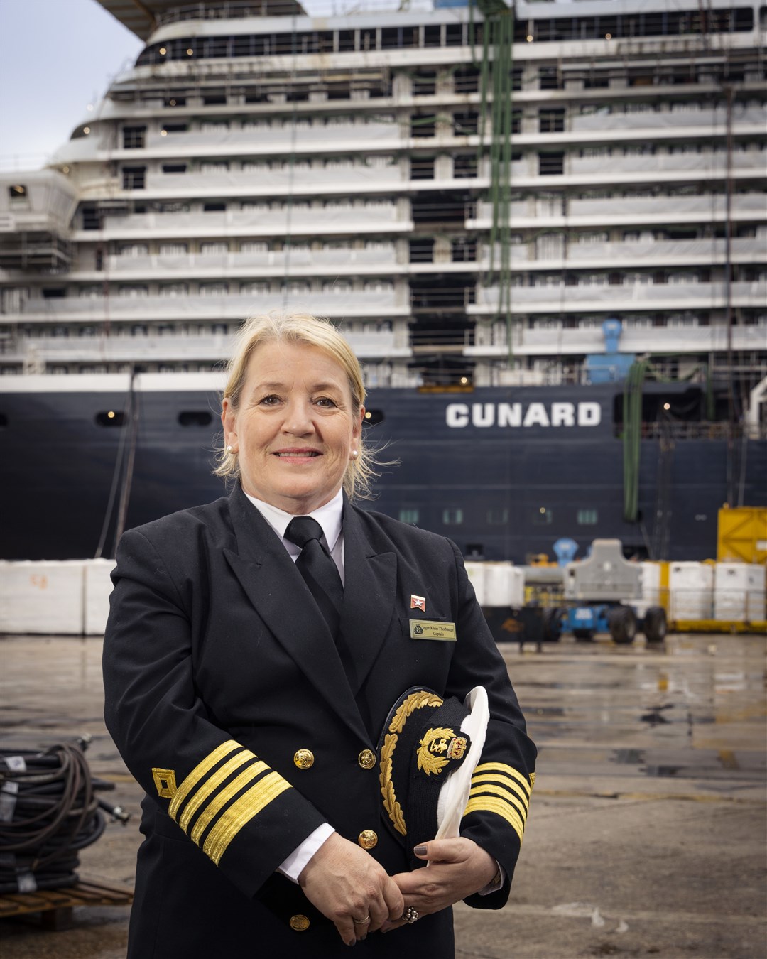 Captain Inger Klein Thorhauge in front of Cunard's new ship, Queen Anne, built at the Fincantieri ship yard near Venice, Italy. Picture Christopher Ison courtesy of Cunard.