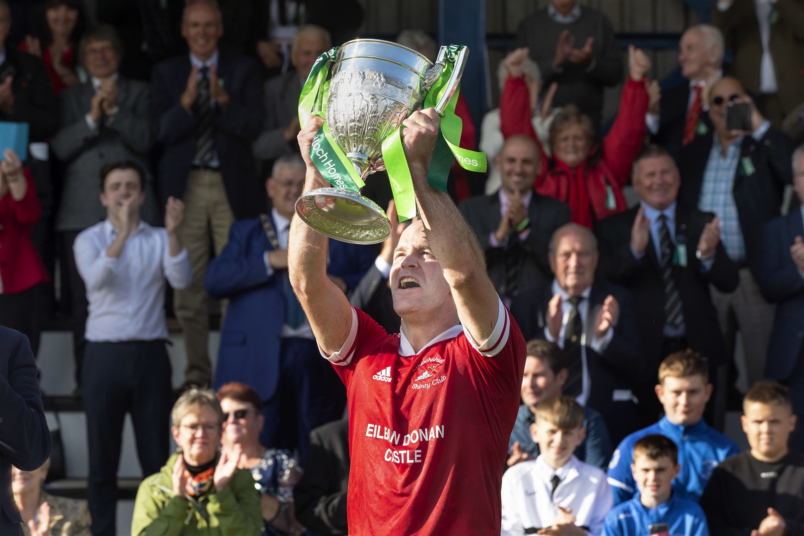 Keith MacRae lifts the Camanachd Cup for Kinlochshiel. Lovat v Kinlochshiel in the Tulloch Homes Camanachd Cup Final, played at Mossfield, Oban.