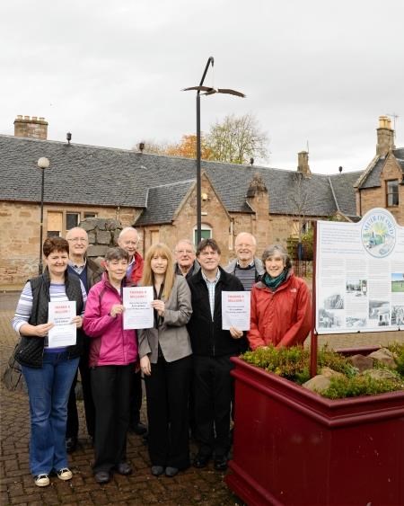 Villagers from Muir of Ord outside Tarradale Old School which they plan to convert into a new community hub. Picture: Alison White.