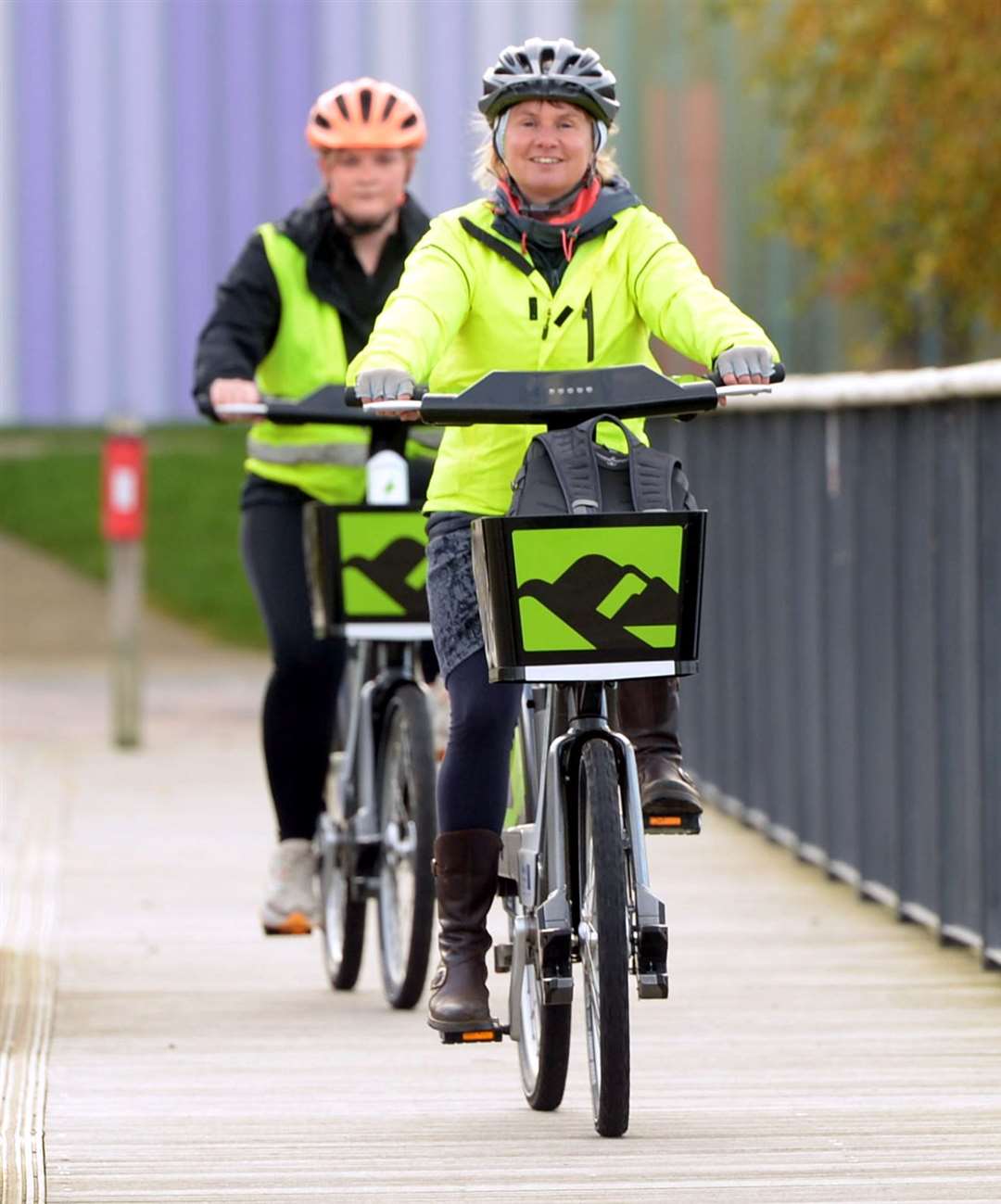 Vikki Trelfer (front) with Imogen James on the new e-bikes. Picture: James Mackenzie