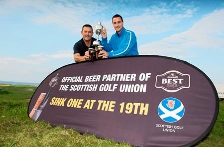 Belhaven Captain and Secretaries Final, Crail Balcomie Links 2014. Winners John Jack (L) and Mike MacDonald (Fortrose and Rosemarkie) celebrate their win with a pint of Belhaven. Picture: Kenny Smith Photography
