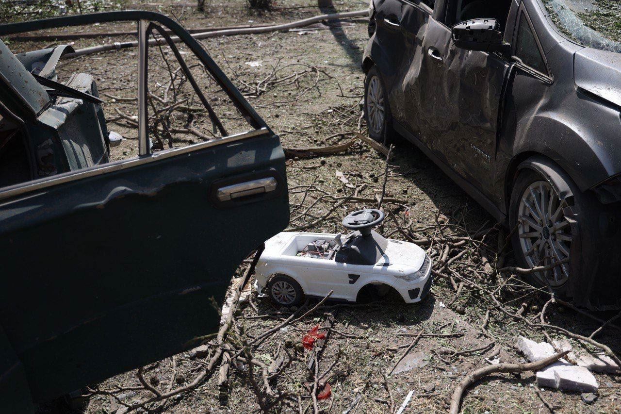 A children's toy survives amid the destruction.