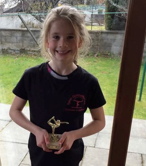 Young Chloe Woods with a gymnastics award.