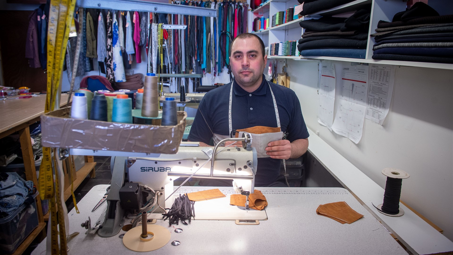 Yusuf Semzi, of Master Tailors in Dingwall, has been making face masks and giving them away for free to locals. Picture: Callum Mackay
