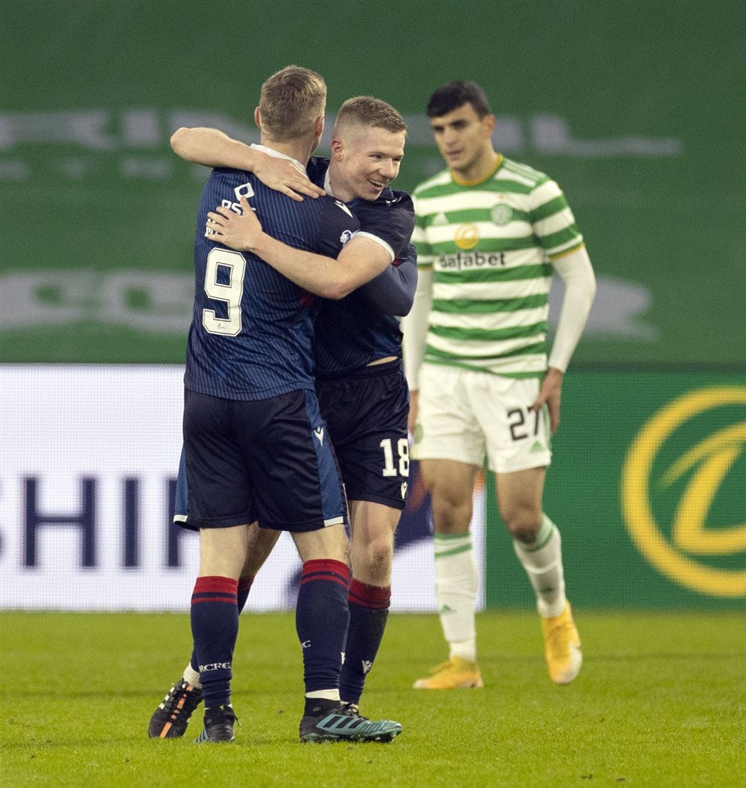 Picture - Ken Macpherson, Inverness. Scottish League Cup 2nd Round. Celtic(0) v Ross County(2). 29.11.20. Ross County's Stephen Kelly and Billy McKay celebrate after the final whistle in front of a disappointed Celtic’s Mohamed Elyounoussi.