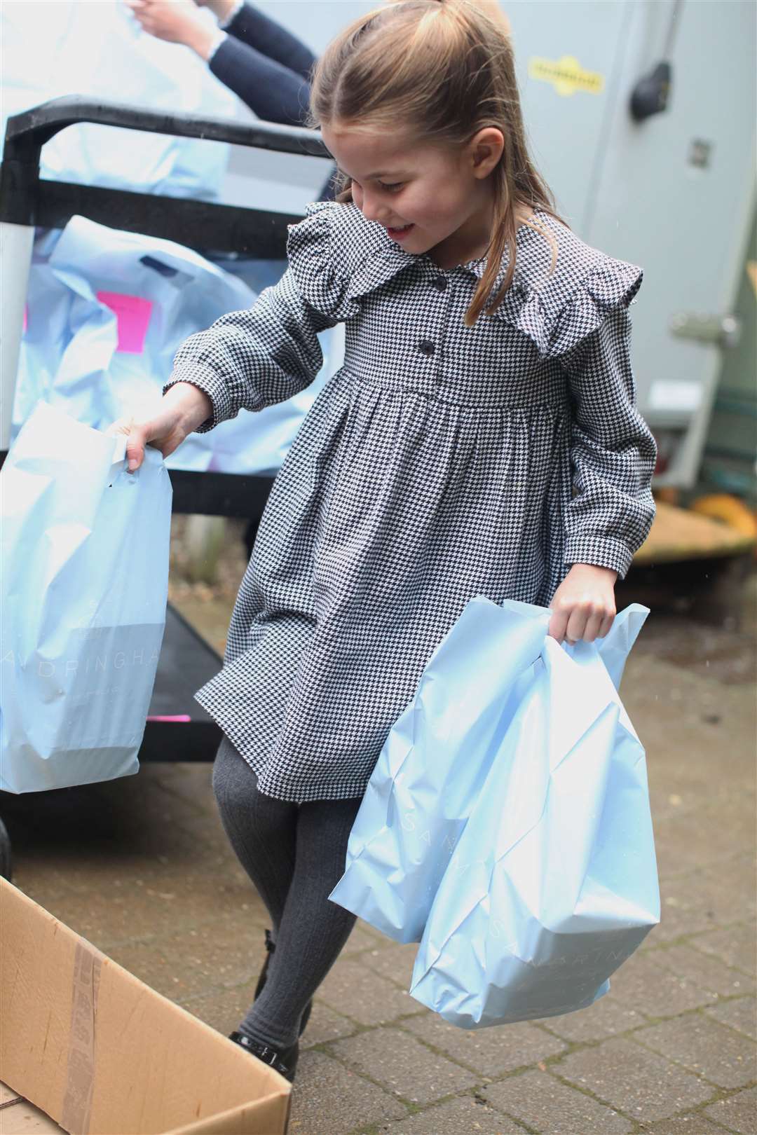 Charlotte, ahead of her fifth birthday, as the family helped to pack up and deliver food packages for isolated pensioners in the local area (The Duchess of Cambridge/PA)