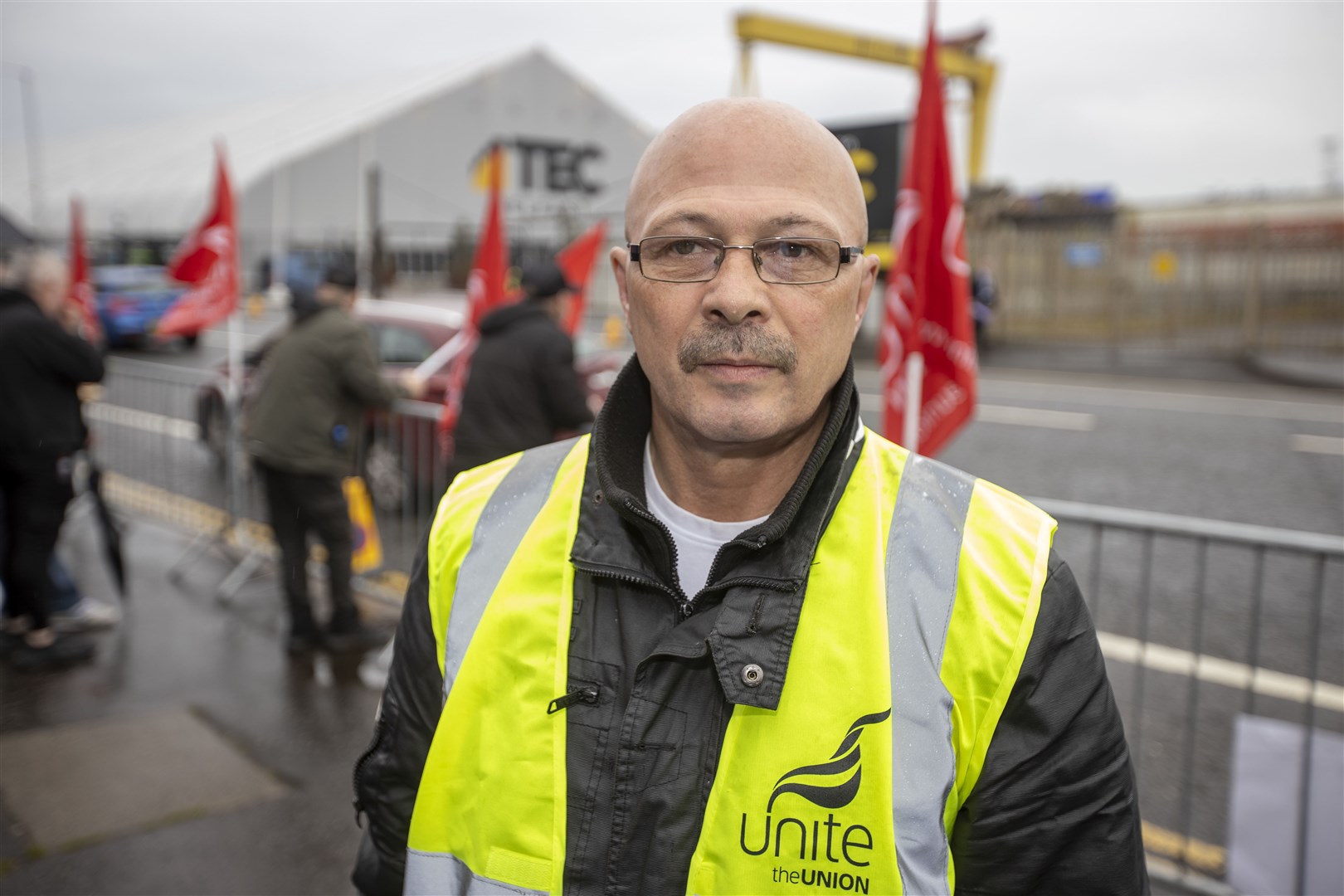 John Moore, Belfast City Council worker and Unite union shop steward joins colleagues outside Titanic Exhibition Centre in Belfast (Liam McBurney/PA)