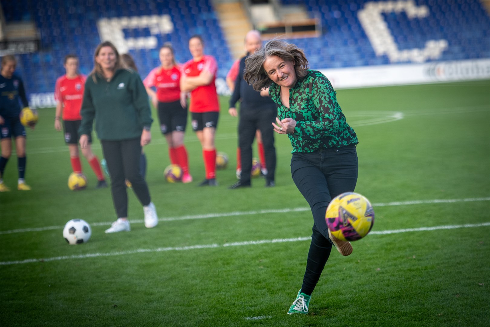 Sports minister Maree Todd shoots from the penalty spot at Ross County's stadium. Picture: Callum Mackay