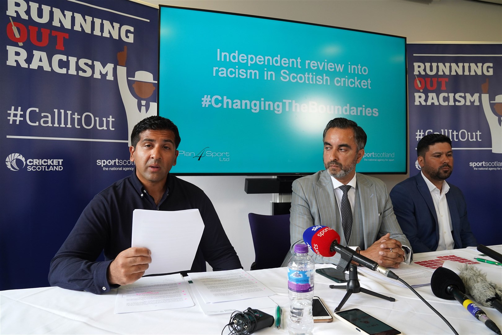 Left to right, Majid Haq, lawyer Aamer Anwar and Qasim Sheikh as the review was published in July (Andrew Milligan/PA)
