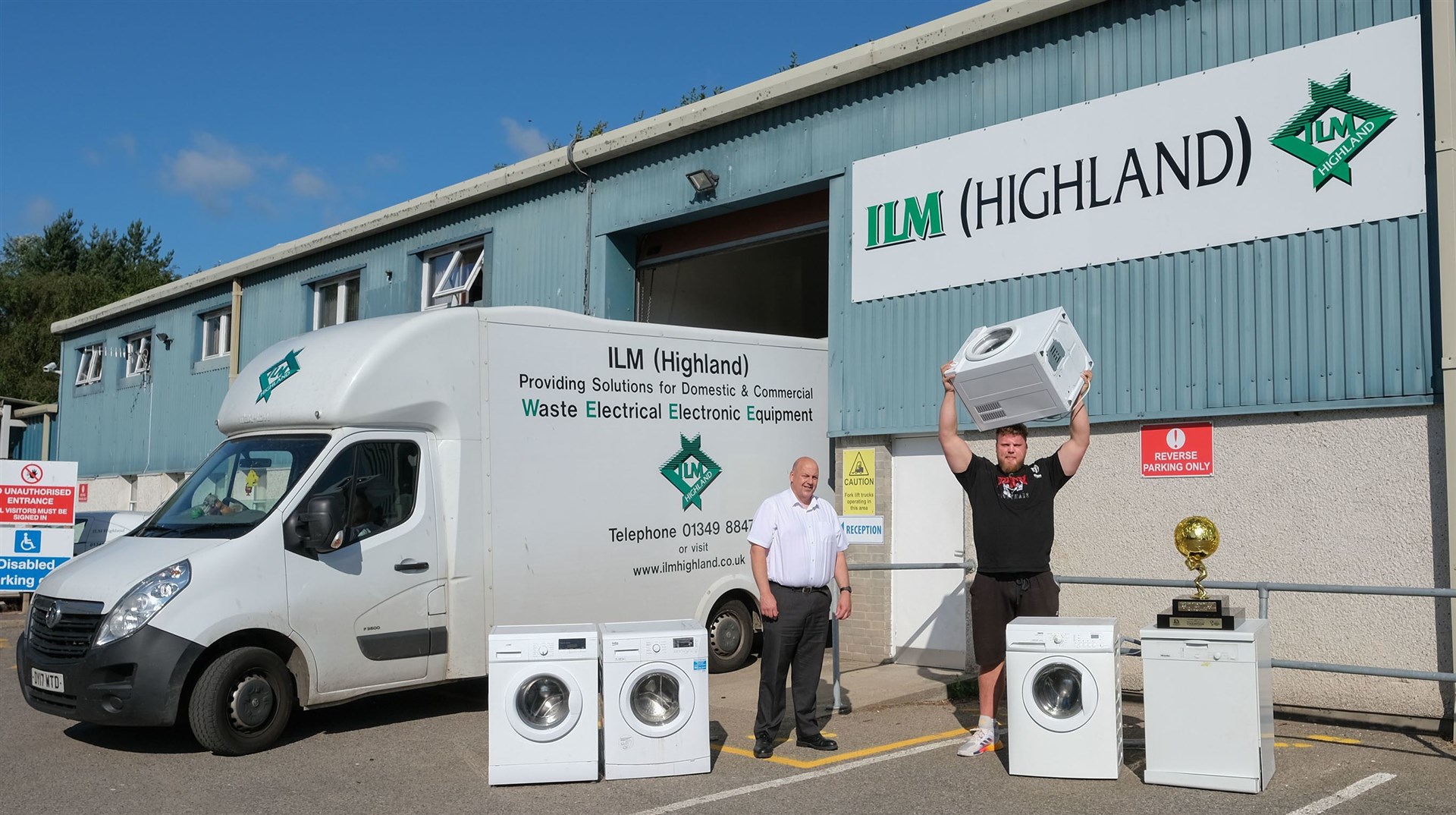 World’s Strongest Man Tom Stoltman (right) and Martin MacLeod celebrate ILM Highland’s environmental and social achievements over the last 12 months.