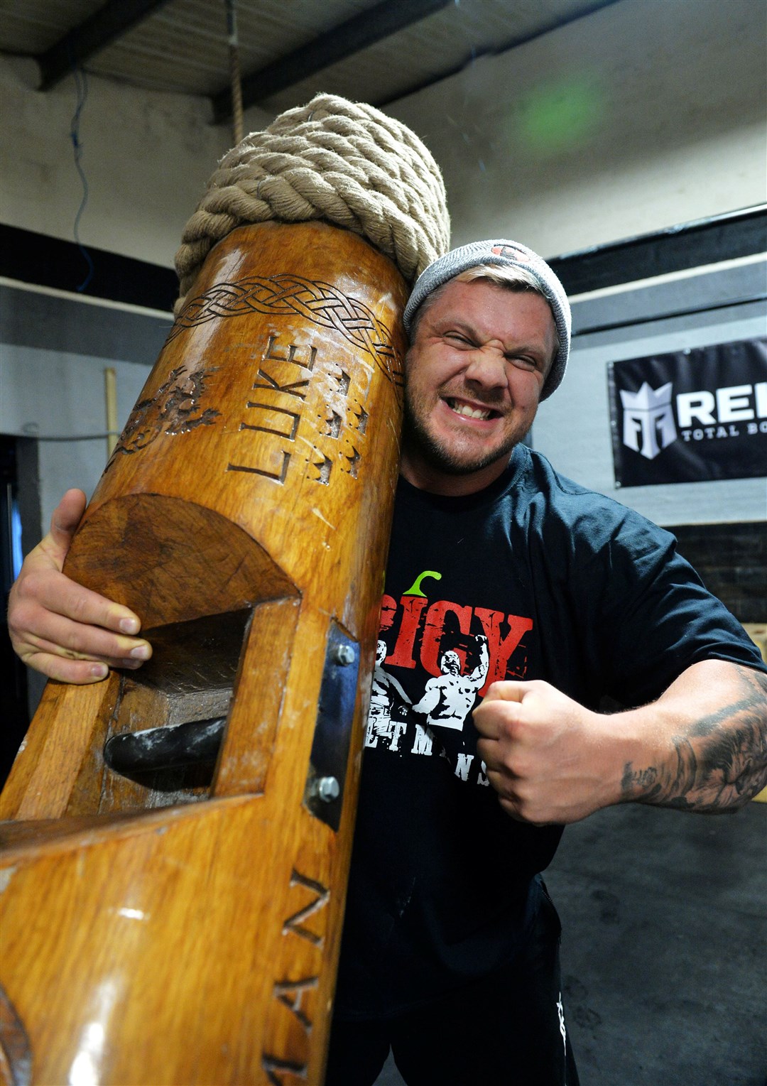 Luke Stoltman, here in strongman mode with a mighty wooden log, is thrilled with the safe arrival of his son. Picture: Callum Mackay