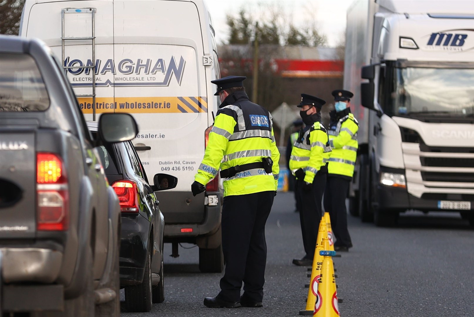 Garda stop vehicles at a checkpoint on the Irish border between Emyvale and Aughnacloy (Liam McBurney/PA)