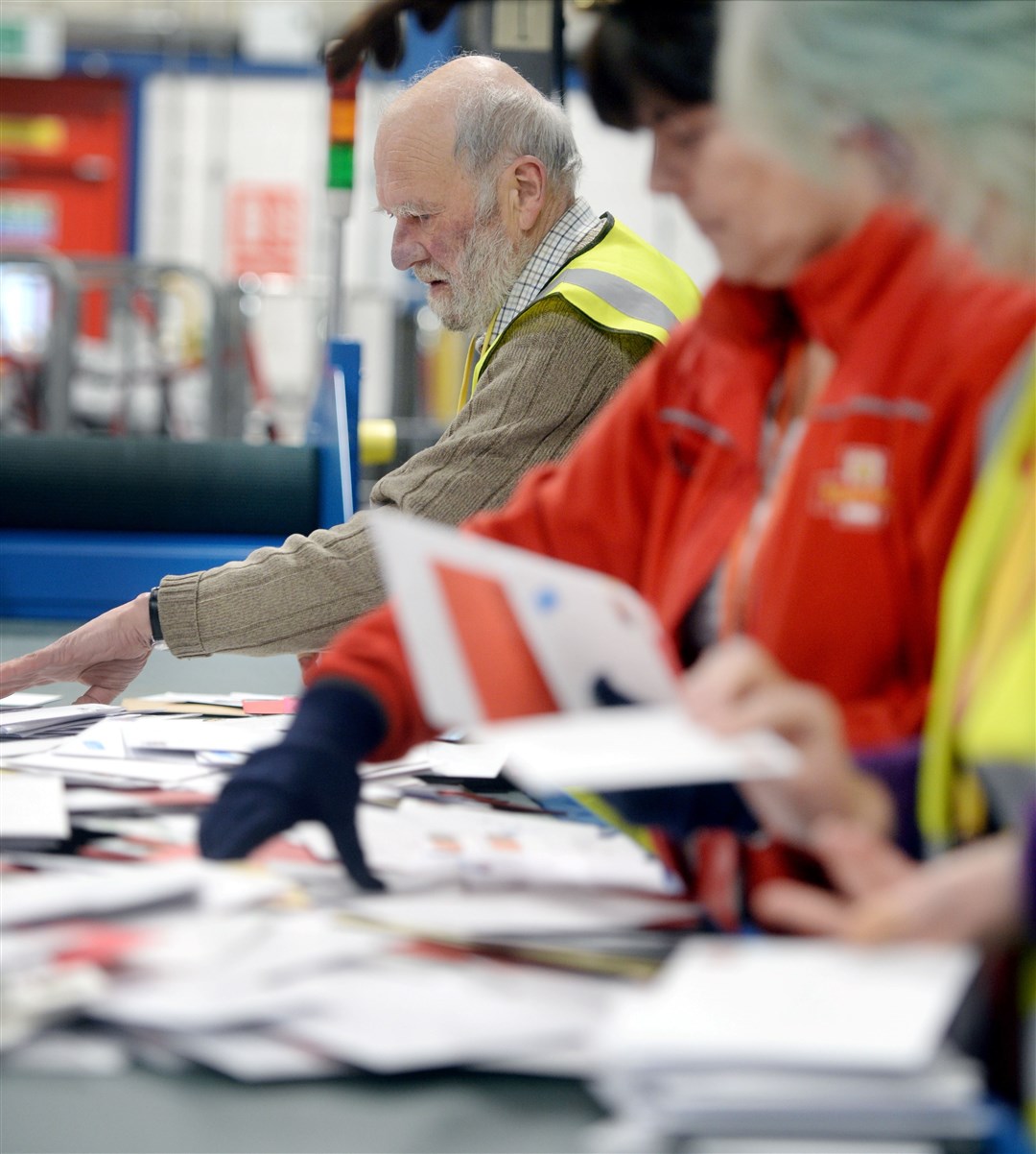 Royal Mail employees sorting mail in Inverness (stock image). Picture: Gair Fraser. Image No. 042766.