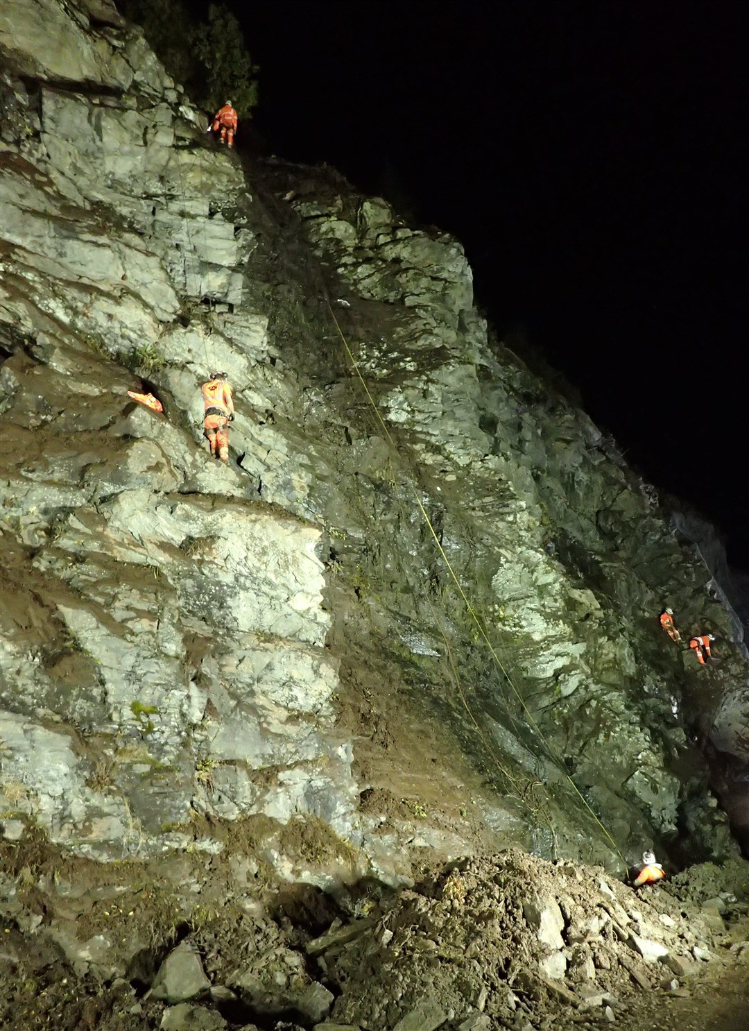 Workers on the rock face during some of last year's night-time works.