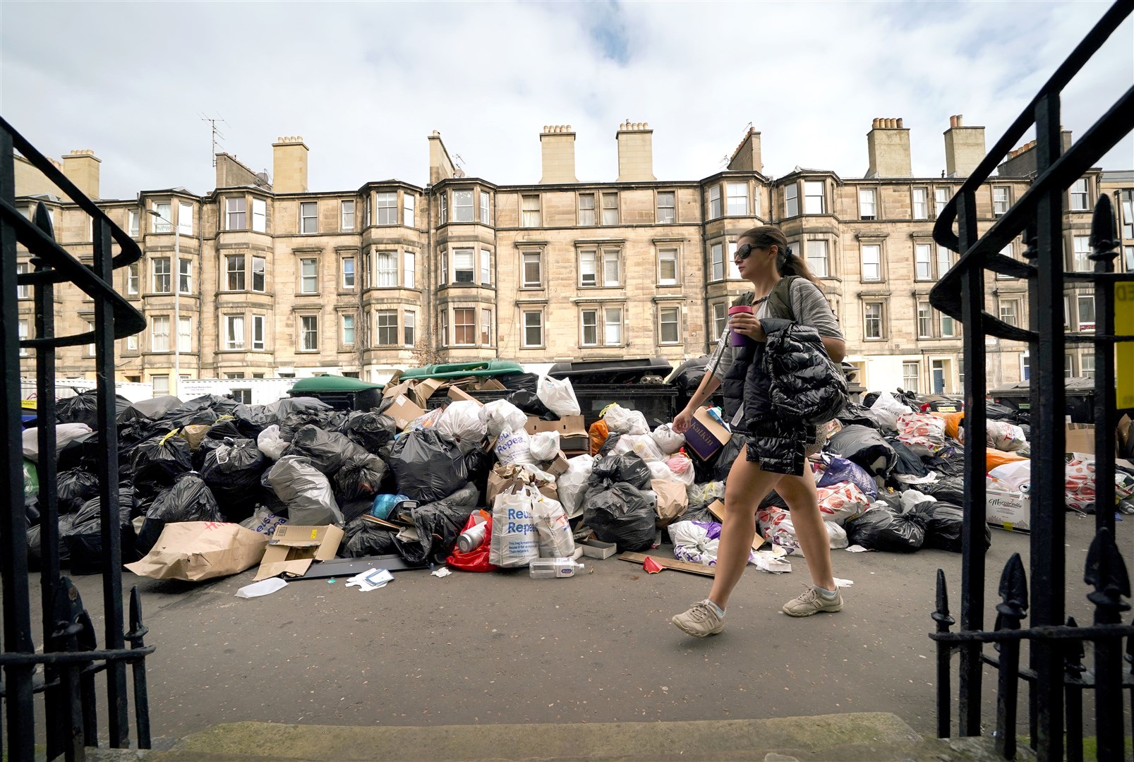 Overflowing bins on the streets of Edinburgh where cleansing workers from the City of Edinburgh Council are on strike (Andrew Milligan/PA)
