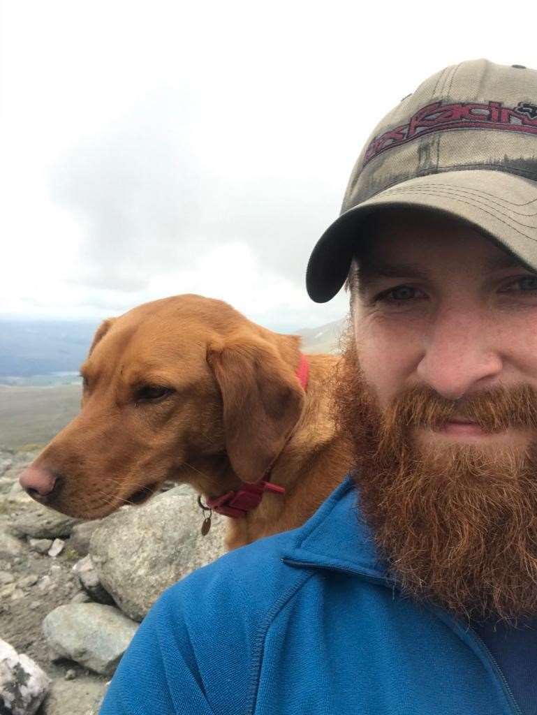 Nathan McLaughlan pictured with his fox-red Labrador Nala.