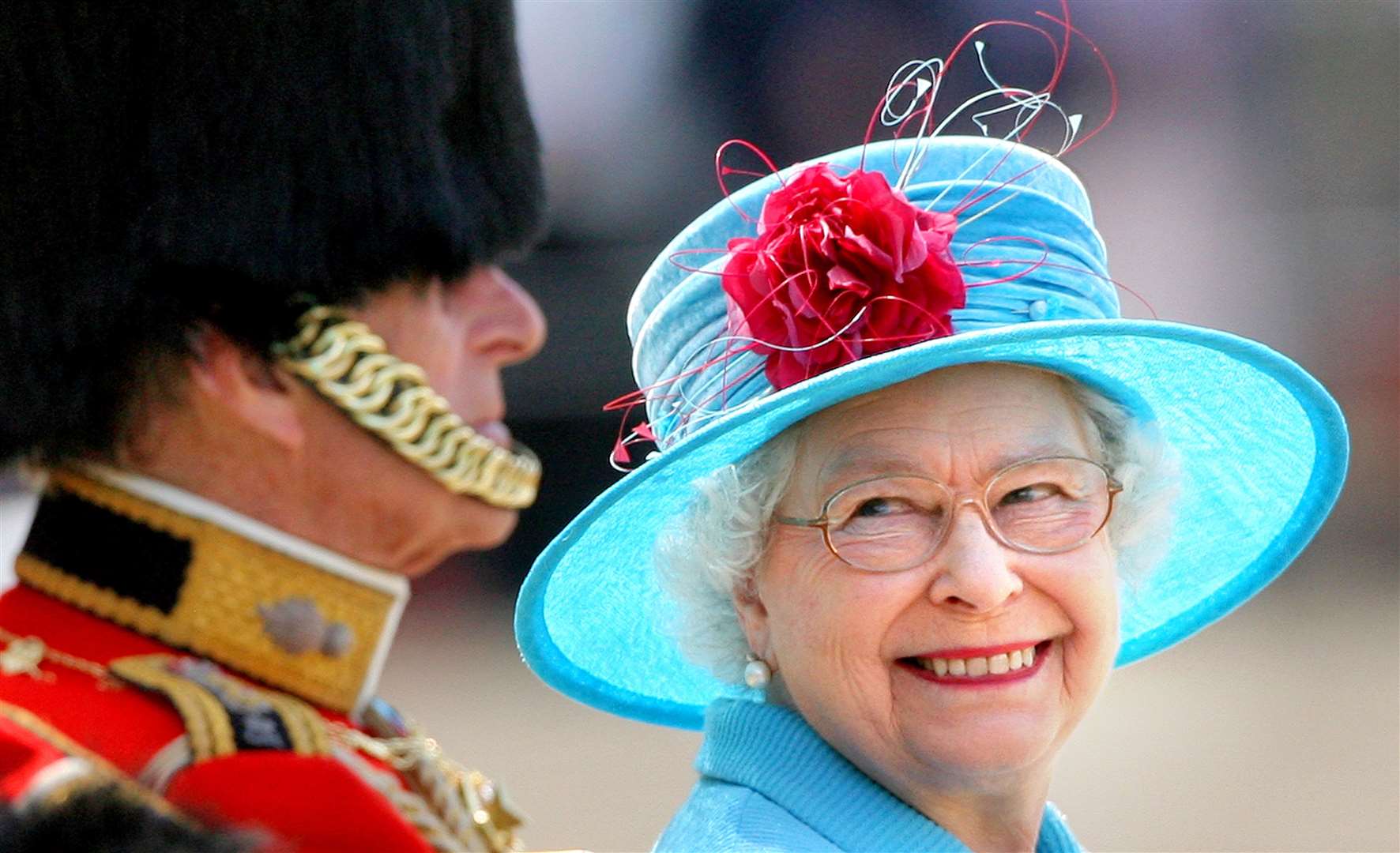 The Queen smiling at the Duke of Edinburgh on Horse Guards Parade during the annual Trooping the Colour parade (PA)