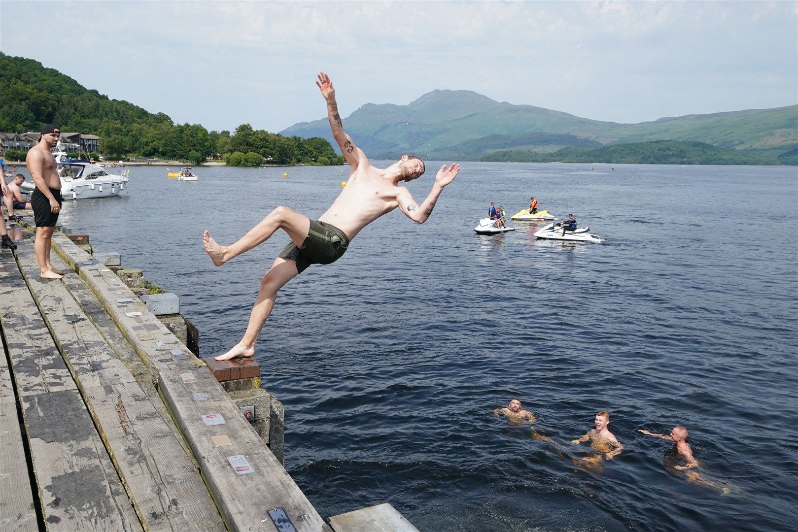 Luss on Loch Lomond proved to be the perfect spot to cool off for these thrill-seekers (Andrew Milligan/PA)