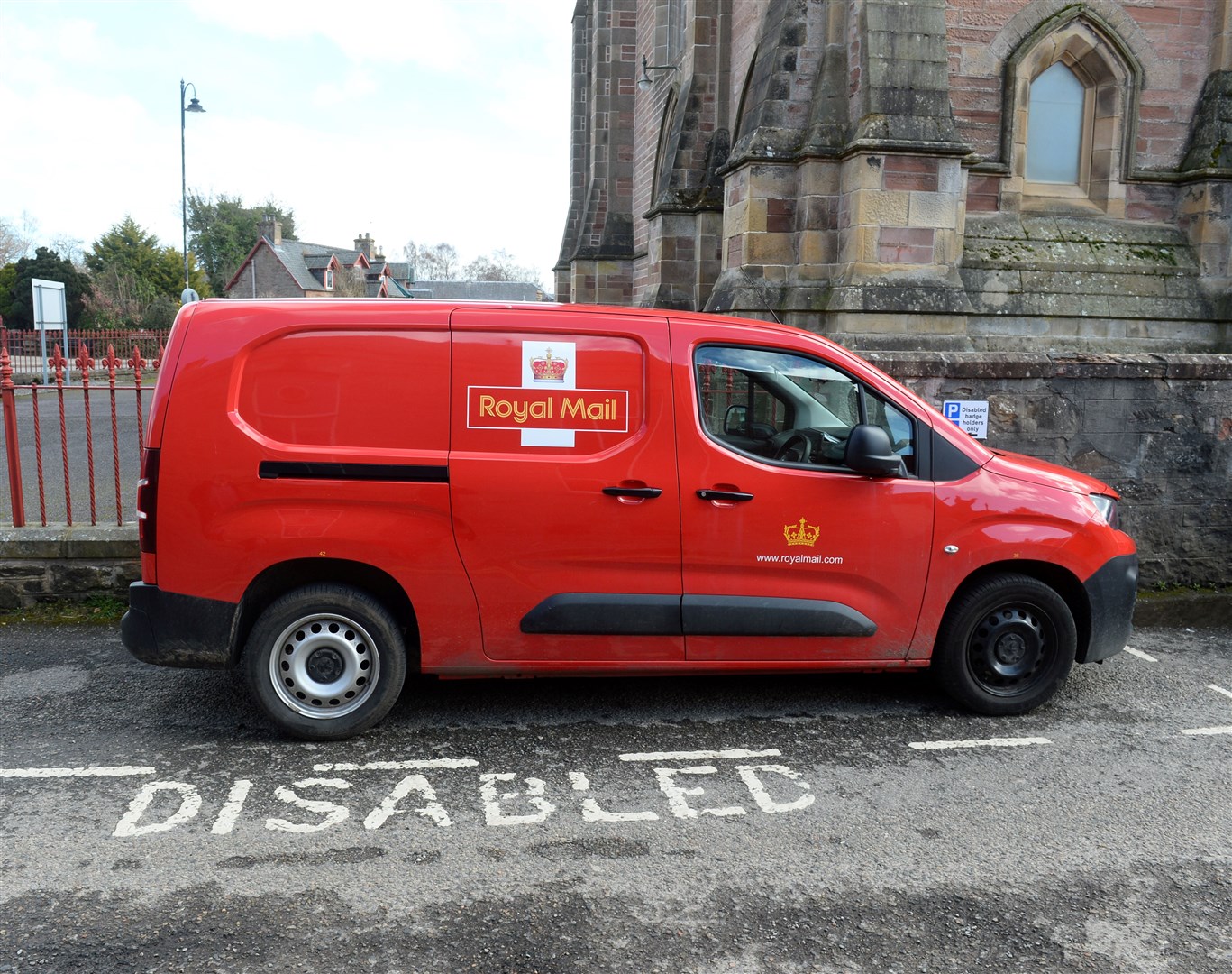 Leslie Mikolajczyk is unhappy with Royal Mail in Park Street Dingwall with vans parking in disabled spaces and on double yellow lines..Picture: Gary Anthony..