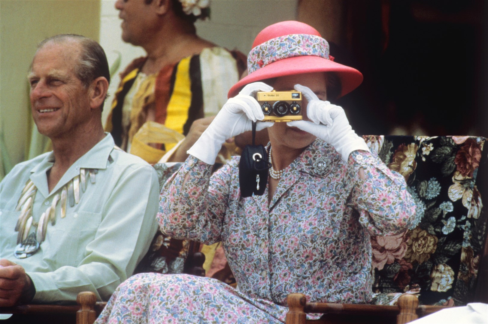 The Queen taking photographs on Tuvalu in 1982 (Ron Bell/PA)