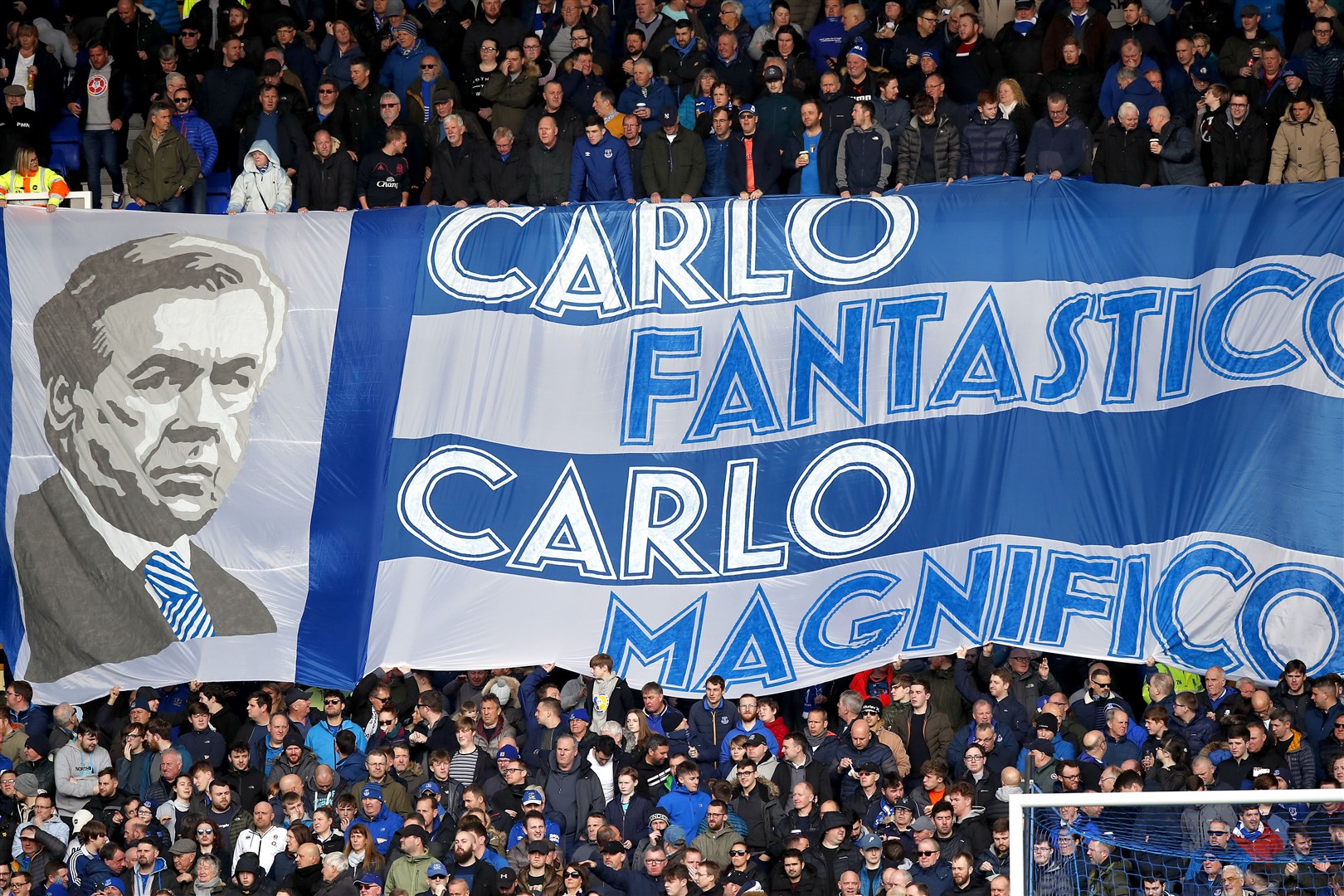 Everton fans hold up a banner for manager Carlo Ancelotti (Martin Rickett/PA)