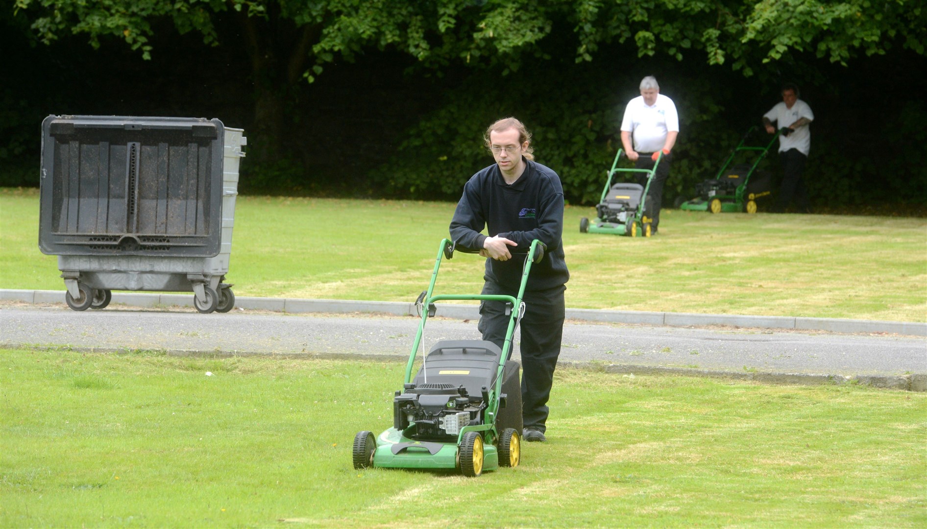 Grass cutting at the Highland Council headquarters in Inverness (file image).