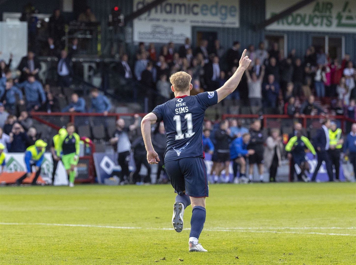 Josh Sims turns away to celebrate after scoring the winning penalty for Ross County. Picture: Ken Macpherson