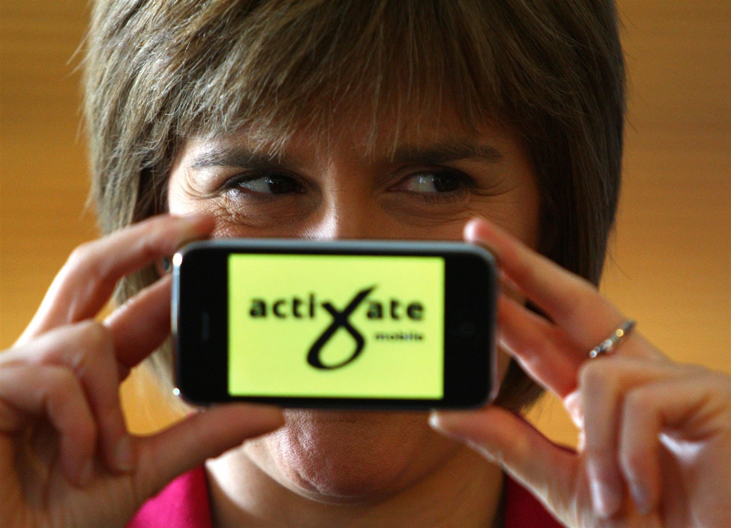 Helping to launch the SNPs online mobile campaigning system for activists in 2009 (Andrew Milligan/PA)