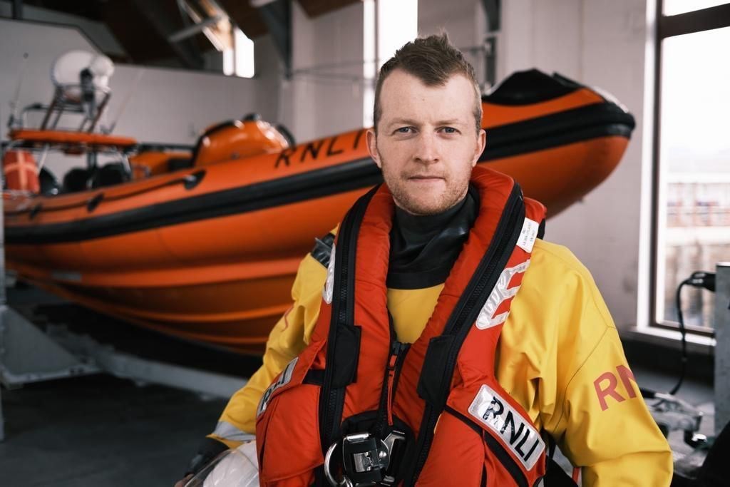 Daniel Elliot in front of the lifeboat.