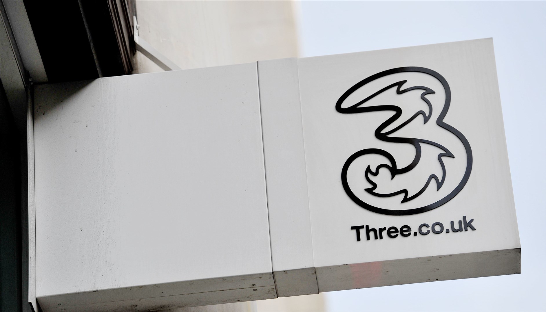 A shop sign for Three mobile in central London (PA)