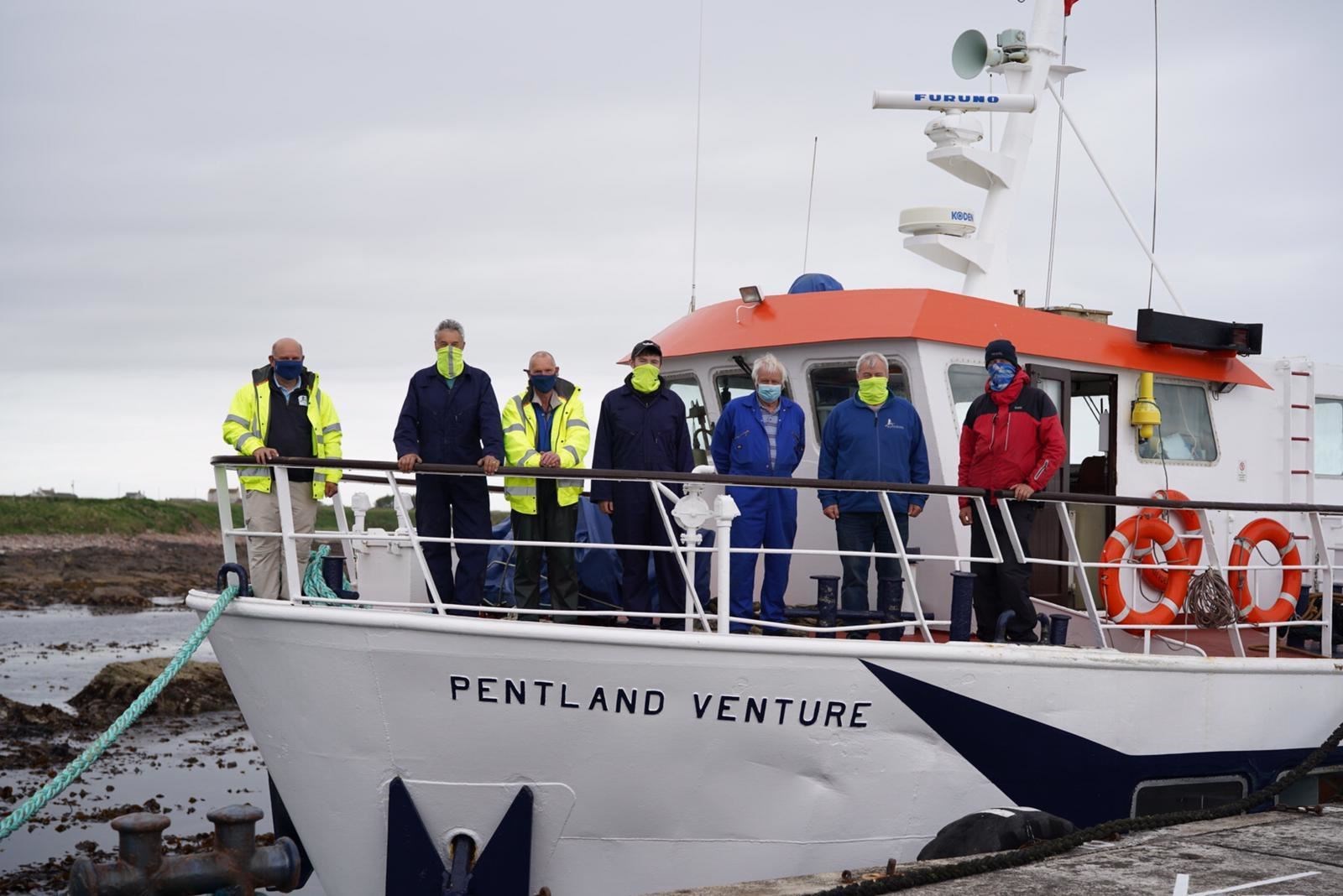 Steve Truluck (right) with staff of John O’Groats Ferries on the Pentland Venture during Orca Watch 2021.