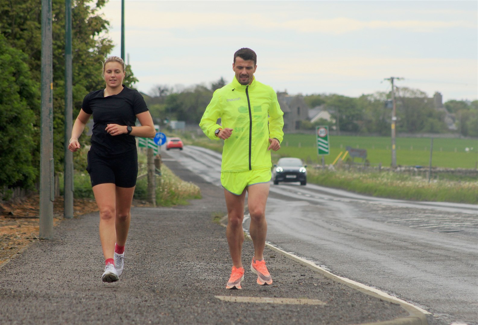 Steven Mackay and fellow runner Seana Forbes heading out of Wick on Sunday morning. Picture: Alan Hendry