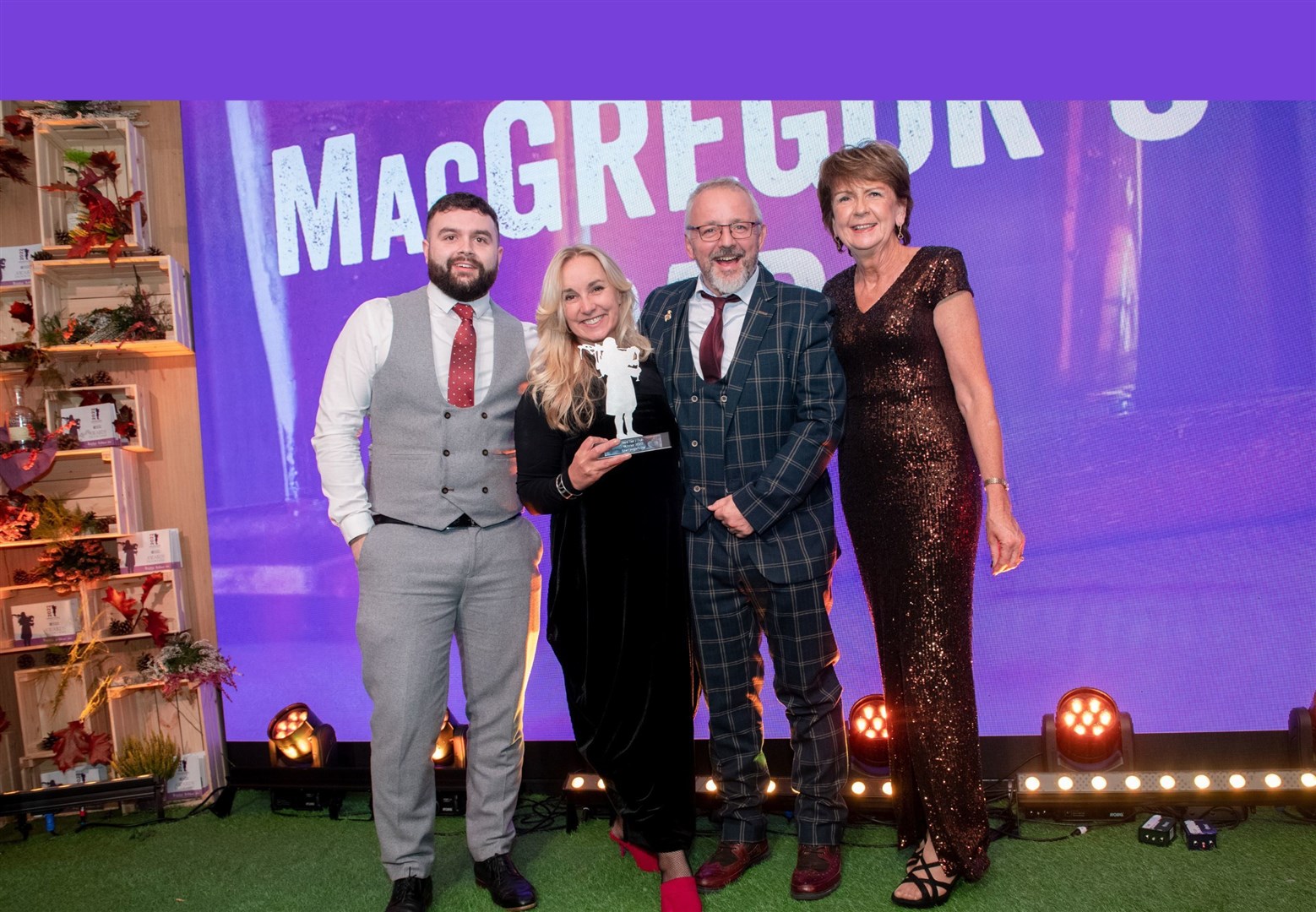 HITA director, Marina Huggett (right) presents the 2022 best bar/pub Thistle award to the team from MacGregor’s. Picture: Callum Mackay