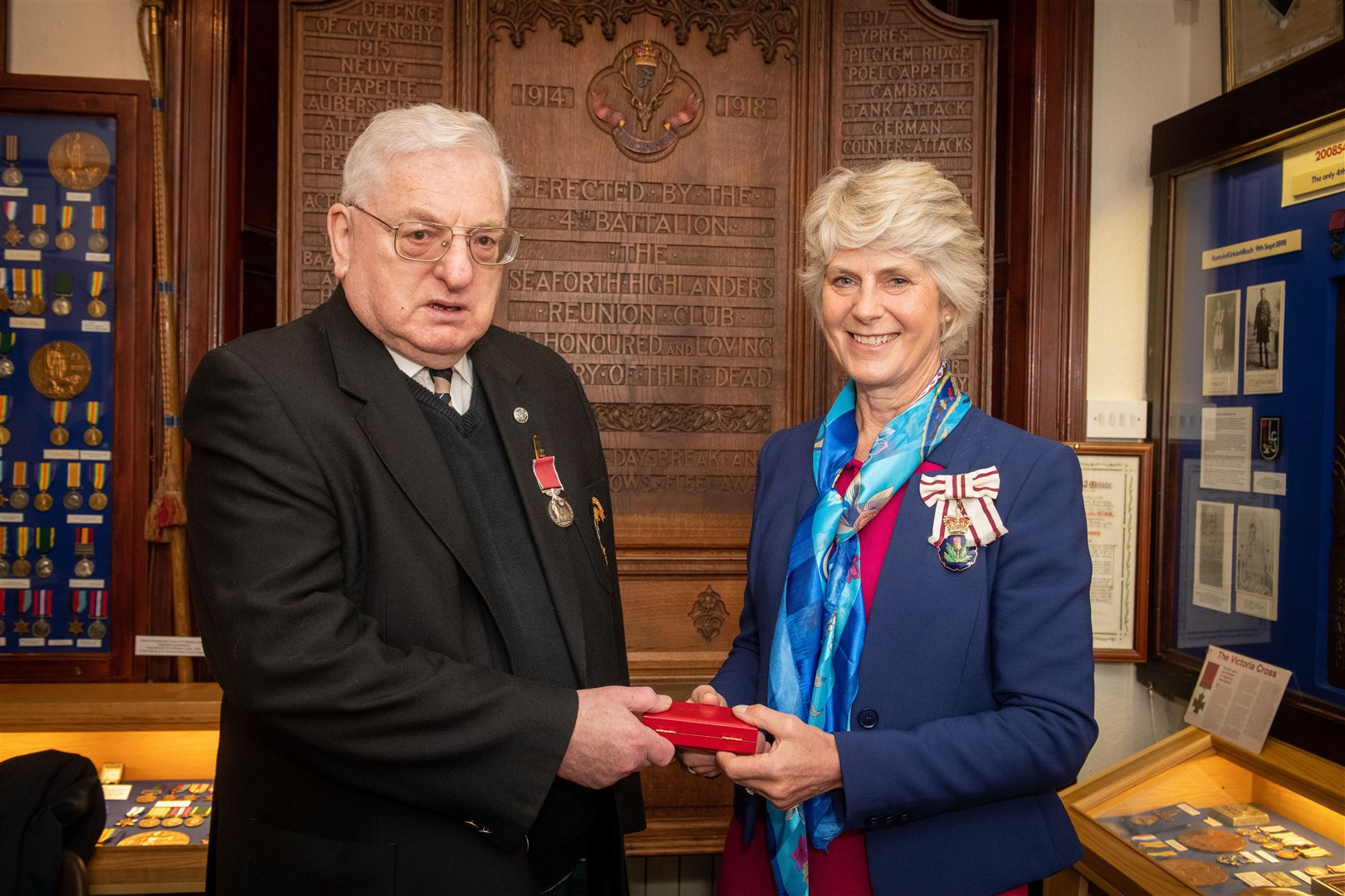 Presentation of British Empire Medal to Bob Shanks in Dingwall Museum by Joanie Whiteford, Lord Lieutenant of Ross and Cromarty.