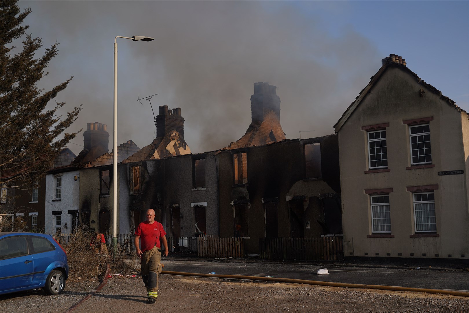 Firefighters at the scene of a blaze in the village of Wennington (Yui Mok/PA)