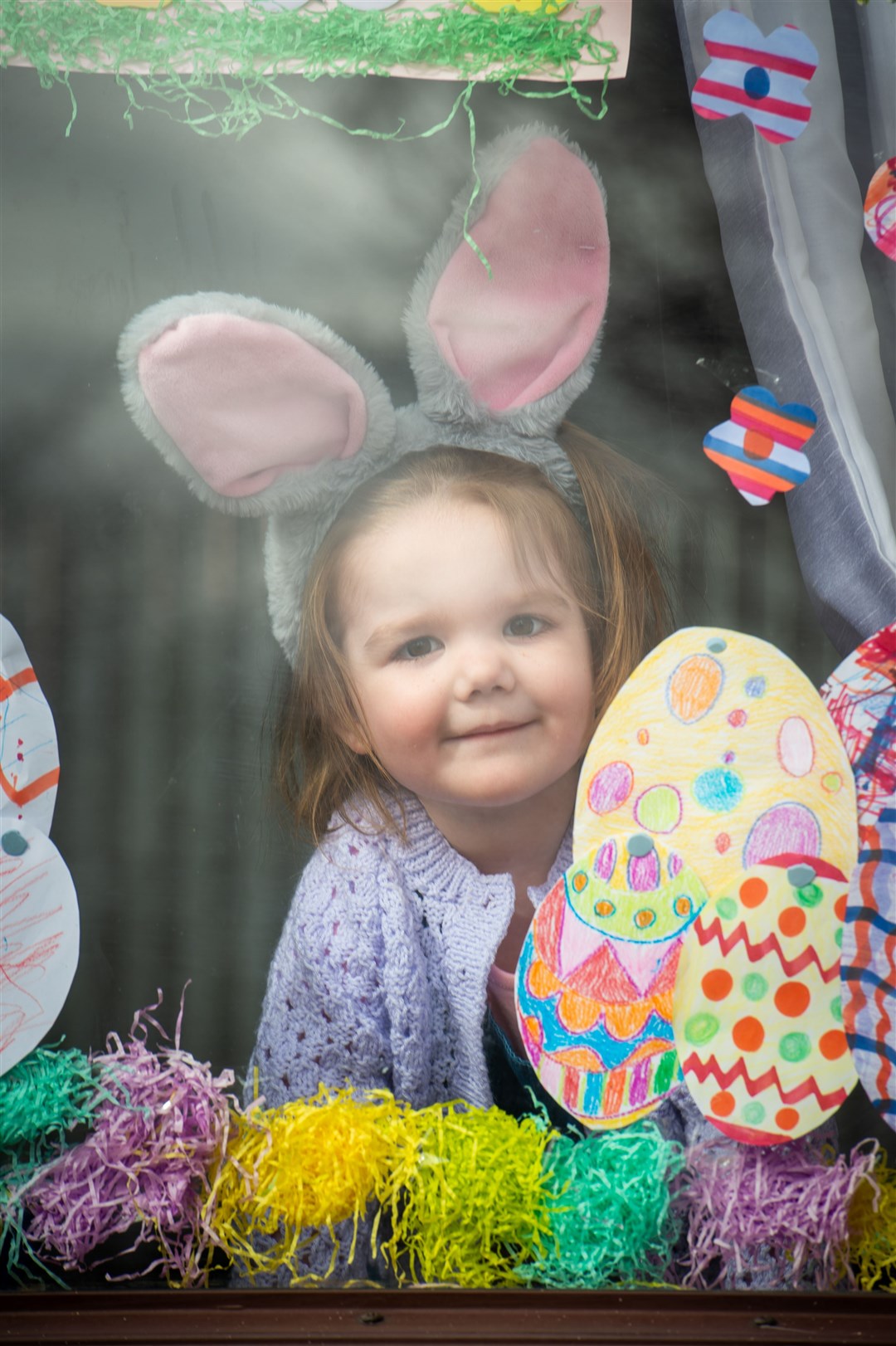 Alness Co-op Easter bunny handing out easter eggs to kids. Adeline Davidson waiting for him to come. Picture: Callum Mackay