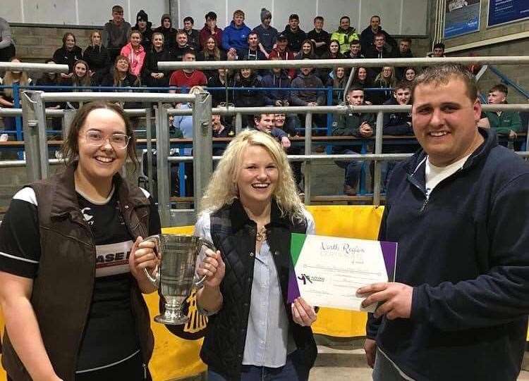 Bower club chairman William Campbell and secretary Beth Douglas collecting the overall points cup from NFU representative and previous club secretary Lynn Sinclair.
