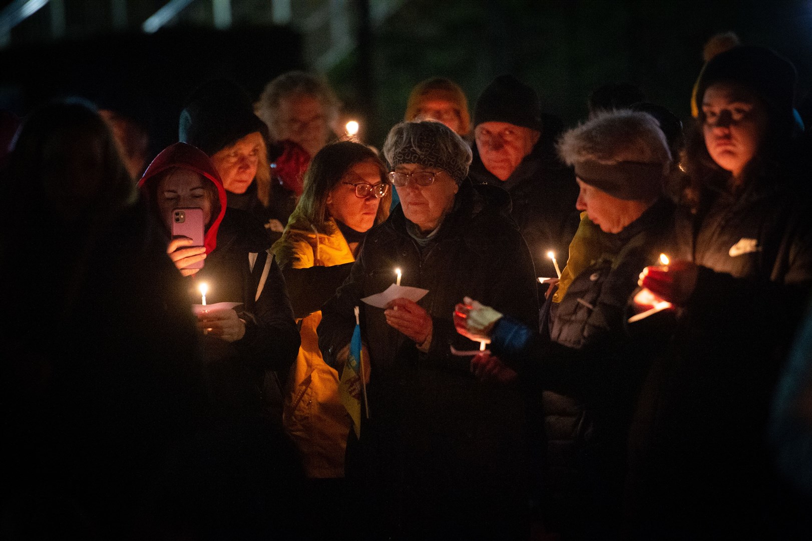 BY CANDLELIGHT: A vigil was held in Inverness earlier this year to mark the one year anniversary of the invasion of Ukraine by Russian forces. Many of these attending currently live in the strath. Picture: Callum Mackay.